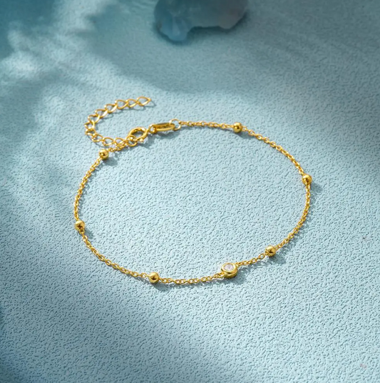 Pulsera chapada en oro de 18 quilates con ojo y perlas de circonita